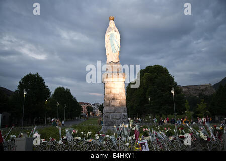 people are praying in Lourdes Stock Photo