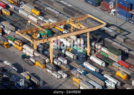 Overhead crane, containers, cisterns in Port of Barcelona in Catalonia, Spain. Stock Photo