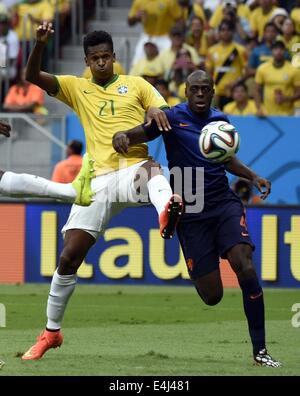 Brasilia, Brazil. 12th July, 2014. Netherlands' Bruno Martins Indi vies with Brazil's Jo during the third place play-off match between Brazil and Netherlands of 2014 FIFA World Cup at the Estadio Nacional Stadium in Brasilia, Brazil, on July 12, 2014. Credit:  Yang Lei/Xinhua/Alamy Live News Stock Photo