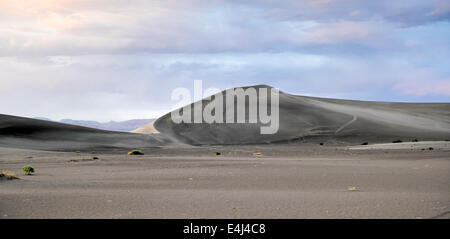 Sand Dunes along the Amargosa Desert at sunset. Located in Nye County in western Nevada, United States. Stock Photo