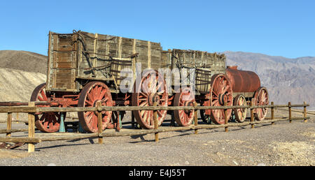 Old wagons and water tank at the Harmony Borax Works where 20 Mule Teams hauled the borax out of Death Valley in the 1880's. Stock Photo