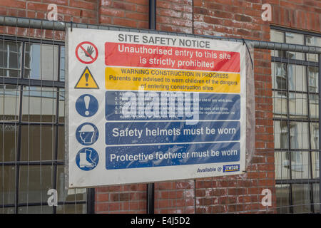 A site safety notice displaying multiple safety signs at a construction site in the Birmingham Jewelery Quarter Stock Photo