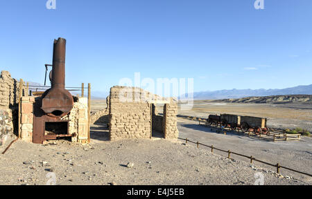 Old wagons and water tank at the Harmony Borax Works where 20 Mule Teams hauled the borax out of Death Valley in the 1880's. Stock Photo