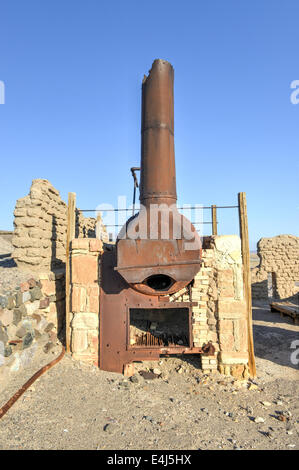 Old wagons and water tank at the Harmony Borax Works where 20 Mule Teams hauled the borax out of Death Valley in the 1880's. Stock Photo