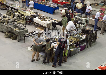 Marietta, GA, USA. 11th July, 2014. Antique military guns show and sale, Marietta GA, where WW2 and other wars' flags, weapons, uniforms, ammunition, etc. are bought and sold between collectors. Pictured: Uniform parts and patches for sale © Robin Rayne Nelson/ZUMA Wire/Alamy Live News Stock Photo