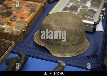 Marietta, GA, USA. 11th July, 2014. Antique military guns show and sale, Marietta GA, where WW2 and other wars' flags, weapons, uniforms, ammunition, etc. are bought and sold between collectors. Pictured: German tanker helmet. © Robin Rayne Nelson/ZUMA Wire/Alamy Live News Stock Photo
