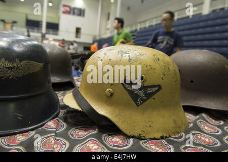 Marietta, GA, USA. 11th July, 2014. Antique military guns show and sale, Marietta GA, where WW2 and other wars' flags, weapons, uniforms, ammunition, etc. are bought and sold between collectors. Pictured: German army helmet © Robin Rayne Nelson/ZUMA Wire/Alamy Live News Stock Photo