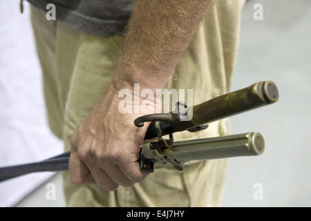 Marietta, GA, USA. 11th July, 2014. Antique military guns show and sale, Marietta GA, where WW2 and other wars' flags, weapons, uniforms, ammunition, etc. are bought and sold between collectors. Pictured: Collector with old bayonets © Robin Rayne Nelson/ZUMA Wire/Alamy Live News Stock Photo