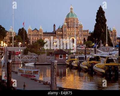A summer, night view of the British Columbia Parliament Buildings and Inner Harbour in Victoria, British Columbia, Canada. Stock Photo