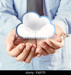 Cloud computing service. Cupped hands holding cloud symbol. Stock Photo