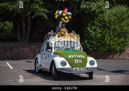 1972 Classic vintage old VW Volkswagen Beetle decorated for the Open Golf at Hoylake, with tiger soft toy on the roof, and a lawned bonnet, Wirral, UK Stock Photo