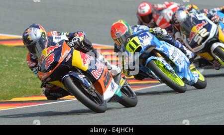 Hohenstein-Ernstthal, Germany. 13th July, 2014. Australian winner Moto3 driver Jack Miller from the Red Bull KTM Ajo Team (L), South African runner-up Brad Binder from the Ambrogio Racing Team and British Danny Kent from the Red Bull Husqvarna Ajo Team during the German Motorcycling Grand Prix at Sachsenring in Hohenstein-Ernstthal, Germany, 13 July 2014. Photo: Hendrik Schmidt/dpa/Alamy Live News Stock Photo