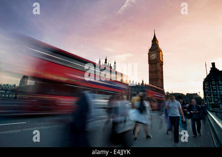 Slow motion blurred tourists and and traffic on Westminster Bridge with Big Ben in background, London. Stock Photo