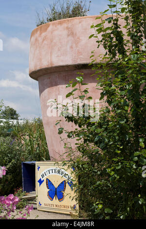 Giant Terracotta Flower Pot in a Garden Future gardens Butterfly world Chiswell Green Hertfordshire England Stock Photo