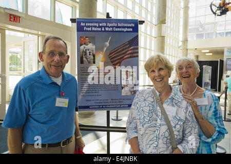 July 12, 2014 - Garden City, New York, U.S - L-R, KEN MALONEY and SUE MALONEY of Houston Texas, and the couple's guest JOAN WEBER, who lives locally in Merrick, are in atrium lobby of Cradle of Aviation Museum for a reunion of former Northrop Grumman Aerospace Corporation employees during a Summer of '69 Celebration held on the 45th Anniversary of NASA Apollo 11 LEM landing on the moon July 20, 1969. Ken was a Lunar Excursion Module LEM spacecraft scheduler at Kennedy Space Center, Florida, for STM, spacecraft test management, and Sue was a secretary for avionics management in Bethpage and fli Stock Photo