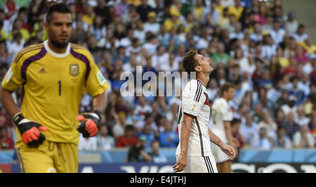 Rio De Janeiro, Brazil. 13th July, 2014. Germany's Miroslav Klose (R) reacts during the final match between Germany and Argentina of 2014 FIFA World Cup at the Estadio do Maracana Stadium in Rio de Janeiro, Brazil, on July 13, 2014. Credit:  Yang Lei/Xinhua/Alamy Live News Stock Photo