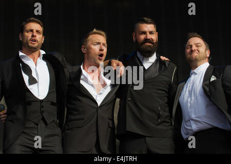 LONDON, ENGLAND - JULY 13: (l-r) Keith Duffy, Ronan Keating, Shane Lynch and Mikey Graham of Boyzone perform on stage at British Stock Photo