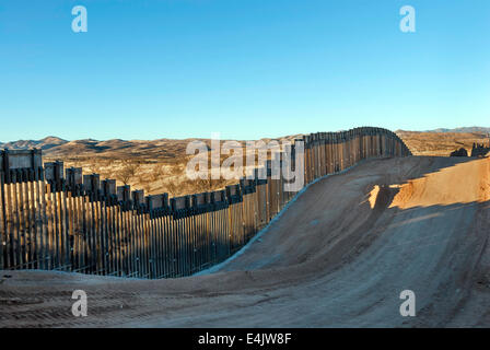 Massive US Border fence, about seven miles east of Nogales Arizona USA, viewed from US side Stock Photo