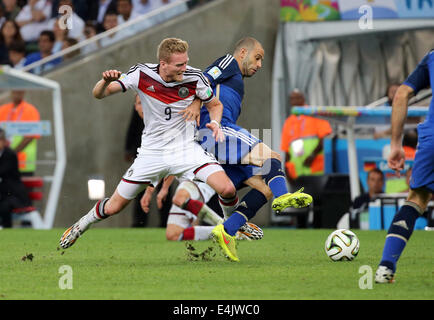 Rio de Janeiro, Brazil. 13th July, 2014. World Cup Final. Germany v Argentina. Schuerrle and Mascherano Credit:  Action Plus Sports/Alamy Live News Stock Photo