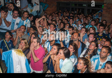 London, UK. 13th July, 2014.  Disappointed Argentinian football fans  watch on as their team id defeated by Germany in the World Cup 2014 final at an Argentinian pub, Moo on London's Vauxhall Bridge Road, Pimlico. Credit:  Mamusu Kallon/Alamy Live News Stock Photo