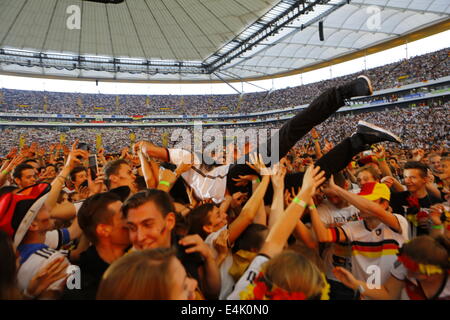 Frankfurt, Germany. 13th July 2014. BŸlent Ceylan goes stage diving. German Turkish comedian BŸlent Ceylan performed in Frankfurt's Commerzbank-Arena ahead of the public viewing of the 2014 FIFA World Cup Final between Germany and Argentina. Credit:  Michael Debets/Alamy Live News Stock Photo