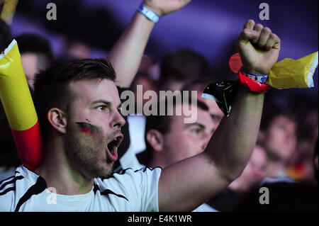 Freiburg, Germany. 13th July, 2014. German football fan at a large public viewing area in Freiburg cheers while watching Germany play Argentina in the final of the FIFA World Cup 2014. Photo: Miroslav Dakov/ Alamy Live News Stock Photo