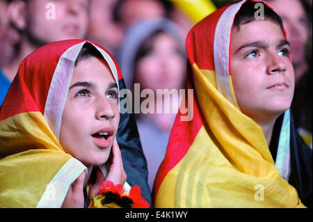 Freiburg, Germany. 13th July, 2014. Football fans at a large public viewing area in Freiburg covered with flags watch Germany play Argentina in the final of the FIFA World Cup 2014. Photo: Miroslav Dakov/ Alamy Live News Stock Photo