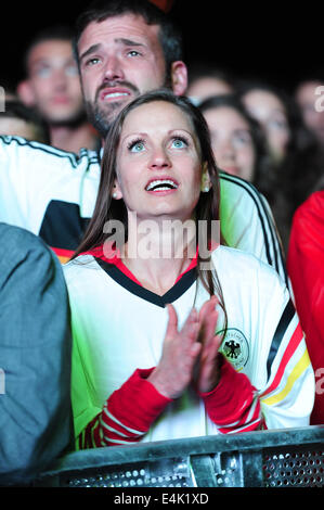 Freiburg, Germany. 13th July, 2014. Football fans at a large public viewing area in Freiburg watch Germany play Argentina in the final of the FIFA World Cup 2014. Photo: Miroslav Dakov/ Alamy Live News Stock Photo