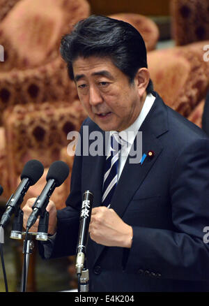 Tokyo, Japan. 14th July, 2014. Prime Minister Shizo Abe launches into his own theory of a new interpretation of Article 9 of the nation's U.S.-drafted post-World War II constitution as Japanese lawmakers meet in the Diet lower house to deliberate the right to collective self-defense in Tokyo on Monday, July 14, 2014. Abe is determined to have the new Japan-U.S. Defense Cooperation Guidelines to be revised late this year. Credit:  Natsuki Sakai/AFLO/Alamy Live News Stock Photo