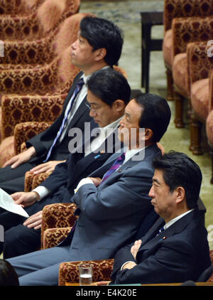 Tokyo, Japan. 14th July, 2014. Prime Minister Shizo Abe and key members of his Cabinet attend a deliberation on the country's right to collective self-defense in the Diet lower house in Tokyo on Monday, July 14, 2014. From background, they are: Defense Minister Itsunori Onodera; Foreign Minister Fumio Kishida; Finance Minister Taro Aso and Abe. Credit:  Natsuki Sakai/AFLO/Alamy Live News Stock Photo
