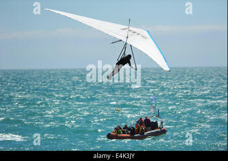 Worthing, Sussex, UK. 13th July, 2014. Kevin Smith flying over the sea at the Worthing International Birdman Competition. Smith flew a total of 82.2m in 12.1 secs coming third. Credit:  Michael Preston/Alamy Live News Stock Photo