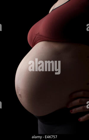 Pregnant Woman, black background Stock Photo
