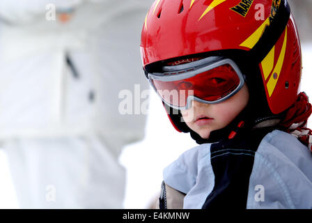 Little skier with helmet and goggles Stock Photo