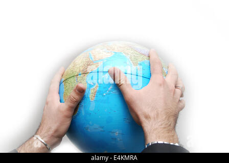 Teamwok concept with hands on globe Stock Photo