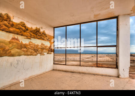 Israel, Dead Sea As seen from within a deserted building of the old Dead Sea Works factory and living quarters, in Sdom, abandon Stock Photo