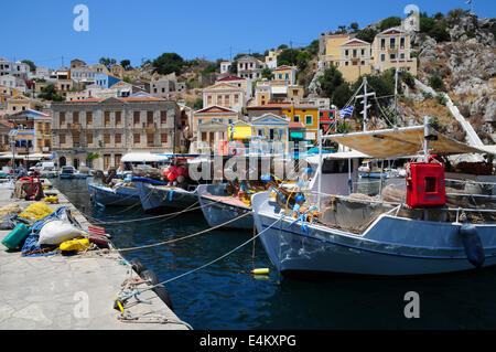 Fishing boats in harbour of Symi on Greek island of Symi Stock Photo