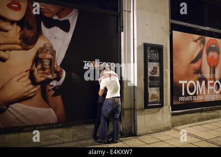 A young couple kissing in public on a weekend night in Cardiff, Wales, UK Stock Photo