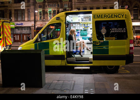 A young woman in an ambulance on a weekend night out in Cardiff, Wales, UK Stock Photo