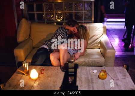 A couple kissing in a club in Cardiff, Wales, UK Stock Photo