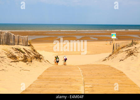 Beach access ramp over the sand dunes to the sea. Stock Photo