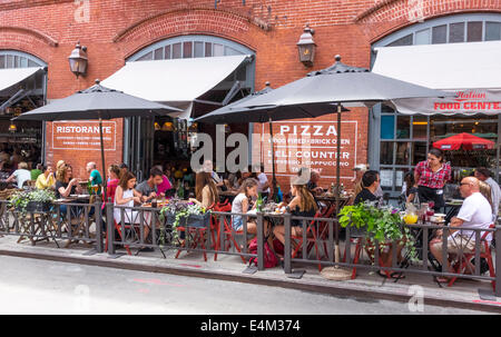 People dining alfresco at a pizzeria restaurant in Little Italy in New York City Stock Photo