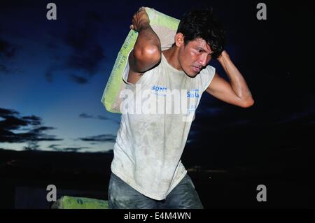 Cement downloading - Amazon river  in Panguana. Department of Loreto .PERU Stock Photo