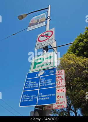 signs on street light pole, multilingual, San Francisco Stock Photo