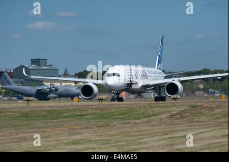 Farnborough, Hampshire, UK. 14th July, 2014. An Airbus A350 performs during the Farnborough International Airshow's Media Day, on Monday July 14, 2014 Credit:  Heloise/Alamy Live News Stock Photo