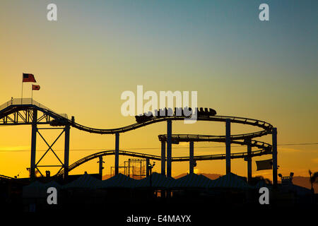 Roller coaster at sunset, Pacific Park, Santa Monica Pier, Santa Monica, Los Angeles, California, USA Stock Photo