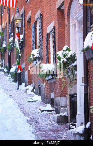 Beautiful Acorn Street in the historic Beacon Hill neighborhood of Boston, Massachusetts in winter with snow. Stock Photo