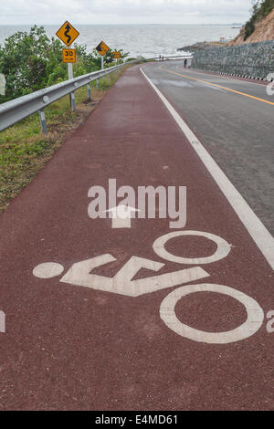 Cyclists symbol sign painted on the road. Stock Photo