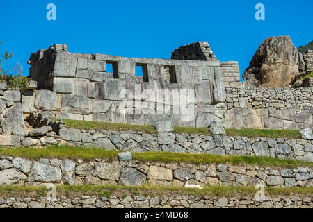 Three Windows Temple in Machu Picchu, Incas ruins in the peruvian Andes at Cuzco Peru Stock Photo