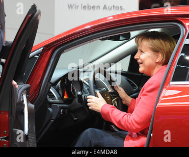 FILE - An archive picture dated 17 September 2009 shows German Chancellor Angela Merkel sitting in an Opel ASstra at Frankfurt Motor Show (IAA) in Frankfurt Main, Germany. Merkel turns 60 on 17 July 2014. Photo: Boris Roessler/dpa Stock Photo