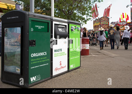 Recycle, waste and organics disposal bins on Calgary Stampede Grounds. Stock Photo